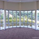 View of lake from indoors with glass doors