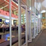 Multi-fold glass doors for commercial establishment
