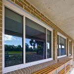 Glass windows installed on brick walls