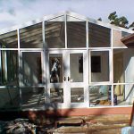 Sunroom with glass and awnings installation